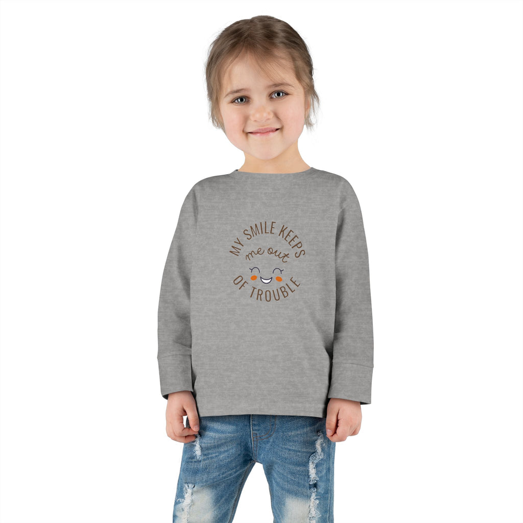My smile keeps me out of trouble Toddler Long Sleeve Tee